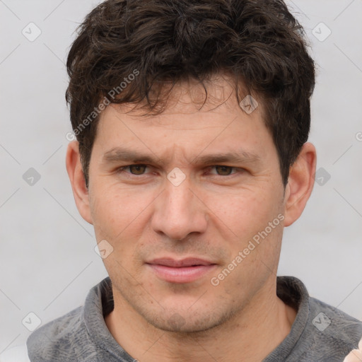 Joyful white adult male with short  brown hair and grey eyes