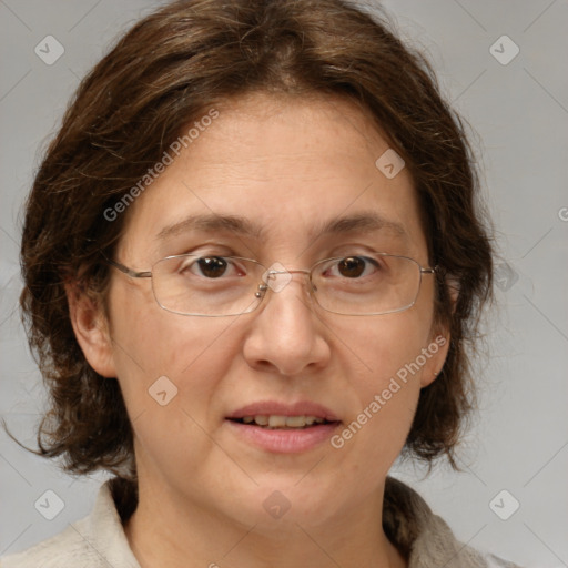 Joyful white adult female with medium  brown hair and brown eyes