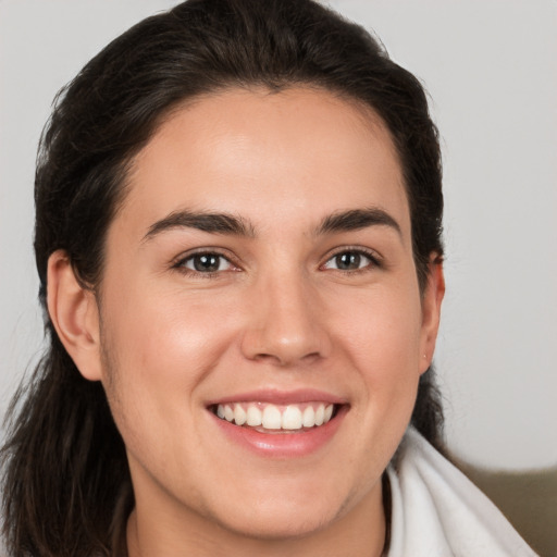 Joyful white young-adult female with medium  brown hair and brown eyes