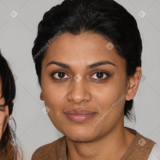 Joyful black young-adult female with medium  brown hair and brown eyes