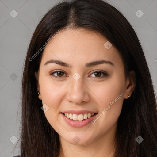 Joyful white young-adult female with long  brown hair and brown eyes