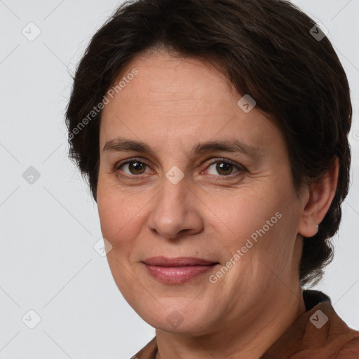 Joyful white adult female with medium  brown hair and brown eyes