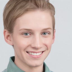 Joyful white young-adult female with short  brown hair and blue eyes