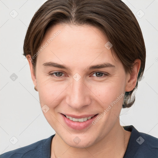 Joyful white young-adult female with short  brown hair and grey eyes