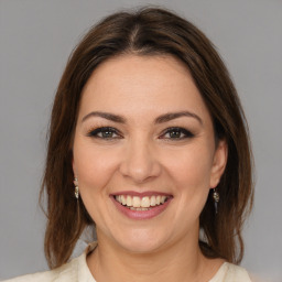 Joyful white young-adult female with medium  brown hair and brown eyes