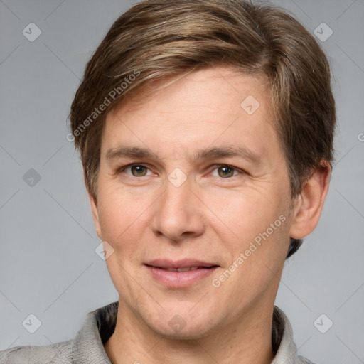 Joyful white adult male with short  brown hair and grey eyes