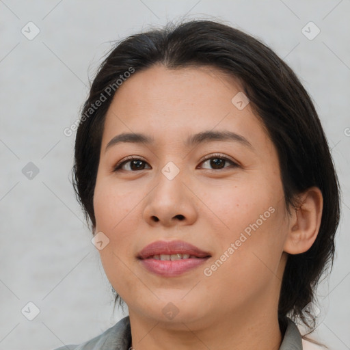 Joyful asian young-adult female with medium  brown hair and brown eyes