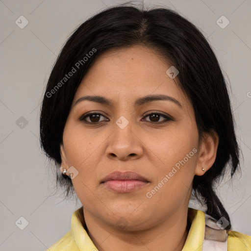 Joyful latino young-adult female with medium  brown hair and brown eyes