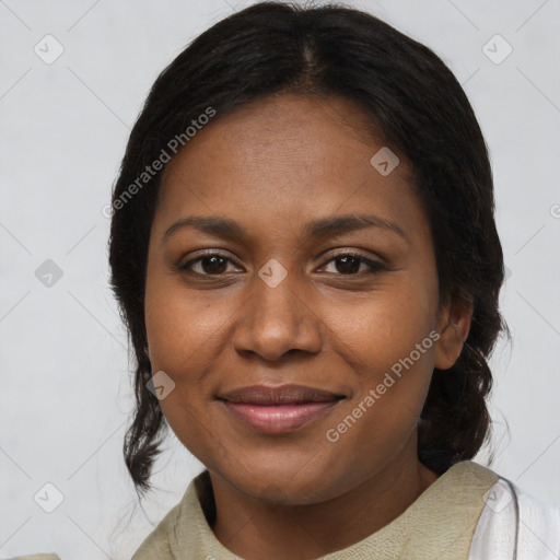 Joyful black young-adult female with medium  brown hair and brown eyes