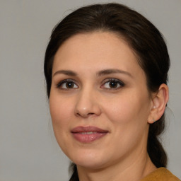 Joyful white young-adult female with medium  brown hair and brown eyes