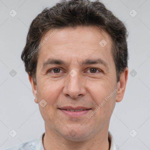 Joyful white adult male with short  brown hair and brown eyes