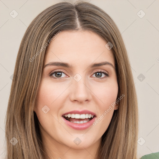 Joyful white young-adult female with long  brown hair and green eyes