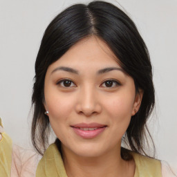 Joyful asian young-adult female with medium  brown hair and brown eyes