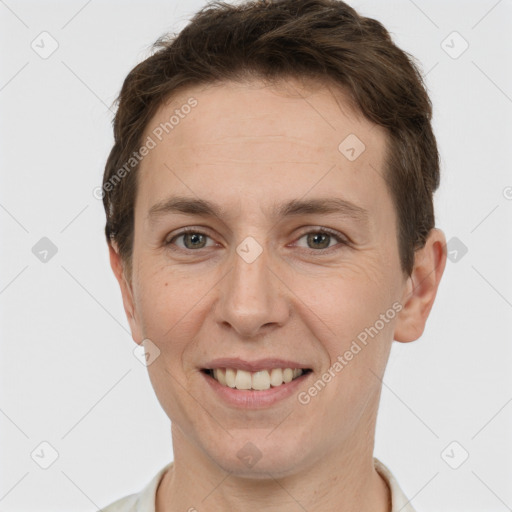 Joyful white adult female with short  brown hair and grey eyes