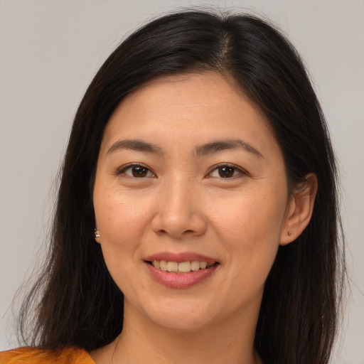 Joyful white young-adult female with medium  brown hair and brown eyes