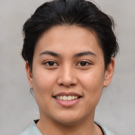 Joyful asian young-adult female with short  brown hair and brown eyes
