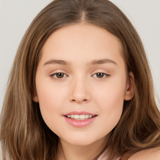 Joyful white child female with long  brown hair and brown eyes