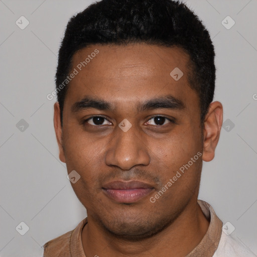 Joyful black young-adult male with short  black hair and brown eyes