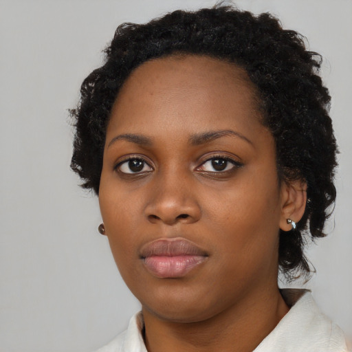 Neutral black young-adult female with short  black hair and brown eyes