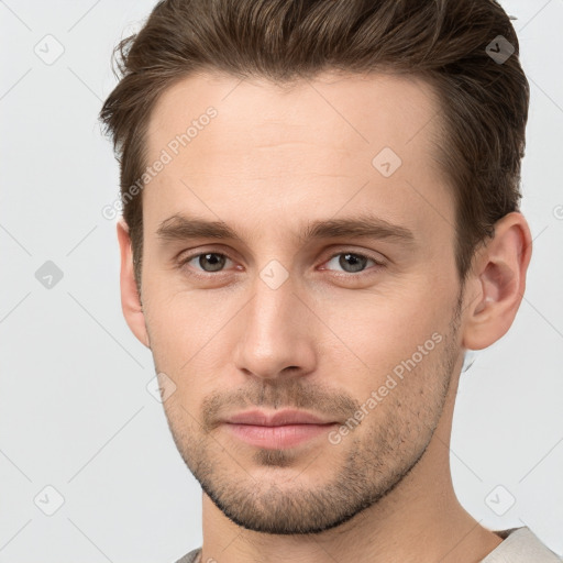 Neutral white young-adult male with short  brown hair and brown eyes