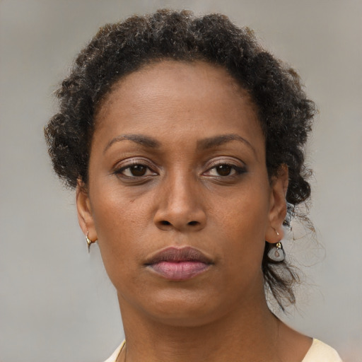 Neutral black adult female with short  brown hair and brown eyes
