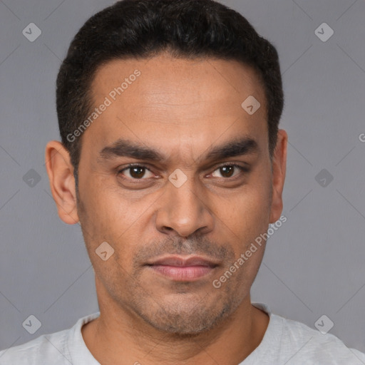 Neutral latino young-adult male with short  black hair and brown eyes