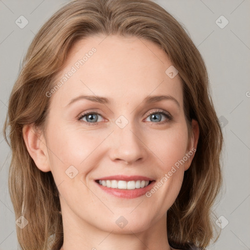 Joyful white young-adult female with long  brown hair and blue eyes