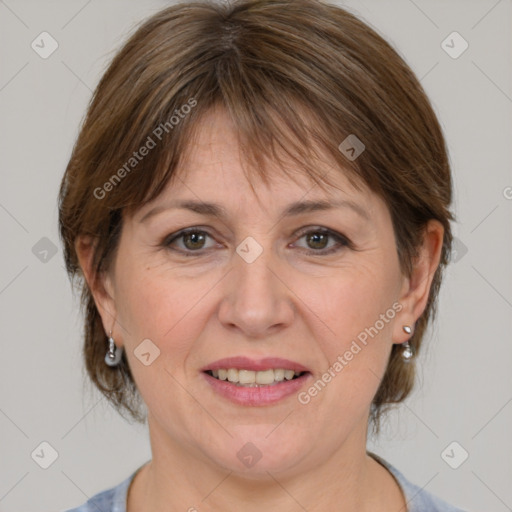 Joyful white adult female with medium  brown hair and grey eyes