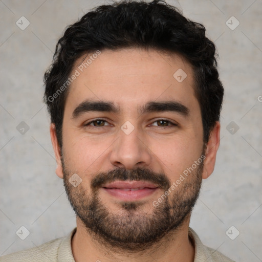 Joyful white young-adult male with short  black hair and brown eyes