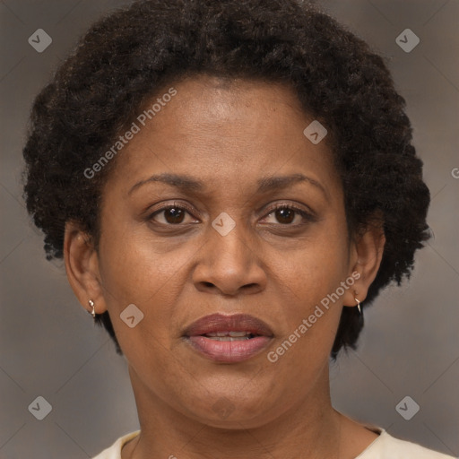 Joyful black adult female with short  brown hair and brown eyes