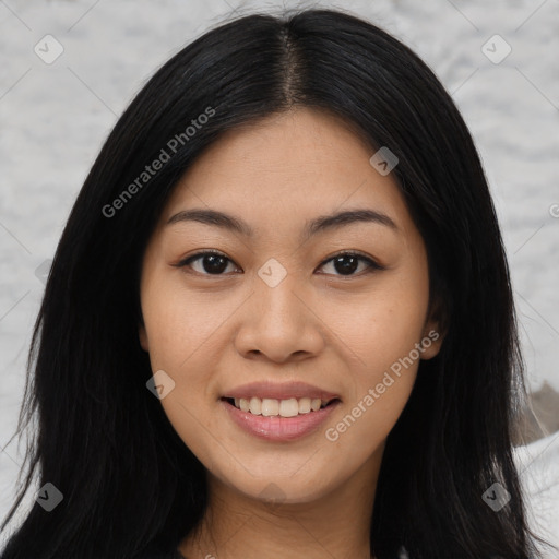 Joyful asian young-adult female with long  black hair and brown eyes