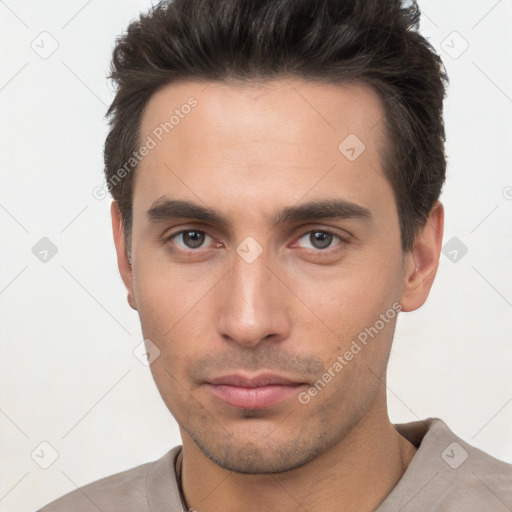 Neutral white young-adult male with short  brown hair and brown eyes