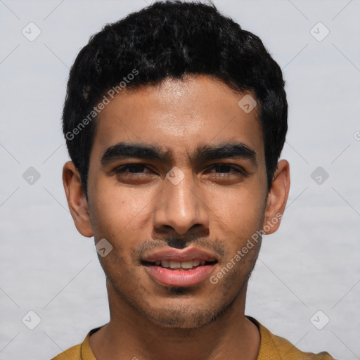 Joyful latino young-adult male with short  black hair and brown eyes