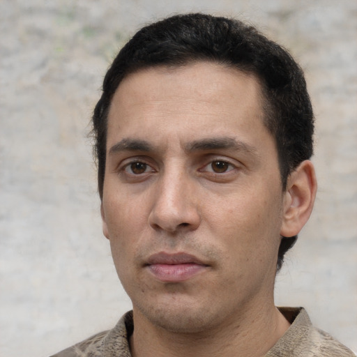 Neutral white young-adult male with short  black hair and brown eyes