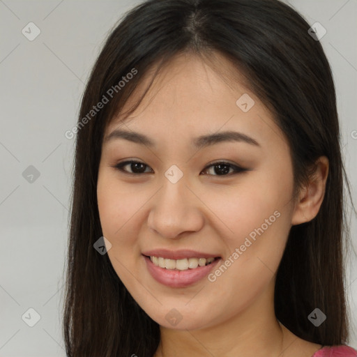 Joyful asian young-adult female with long  brown hair and brown eyes