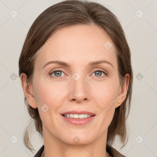 Joyful white adult female with medium  brown hair and grey eyes