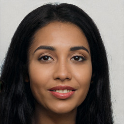 Joyful latino young-adult female with long  black hair and brown eyes