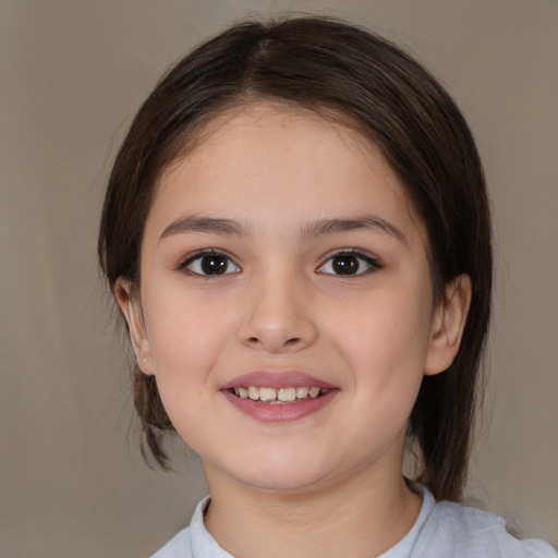 Joyful white child female with medium  brown hair and brown eyes