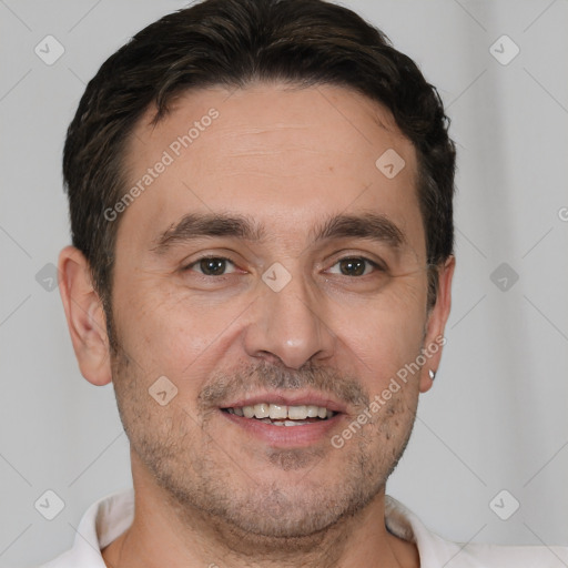 Joyful white adult male with short  brown hair and brown eyes