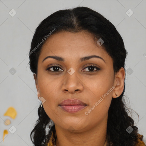 Joyful black young-adult female with long  brown hair and brown eyes