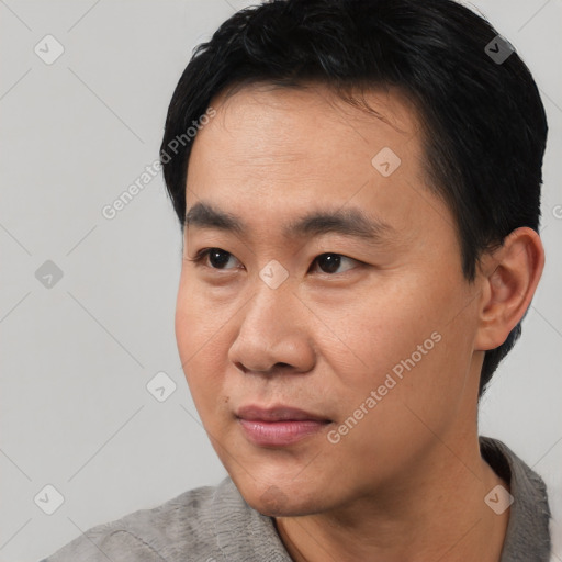 Neutral asian young-adult male with short  black hair and brown eyes