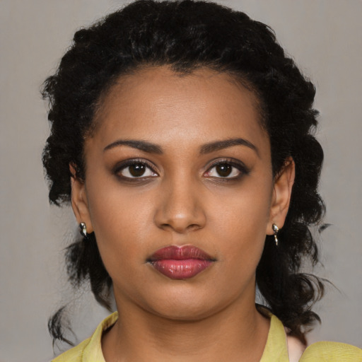 Neutral black young-adult female with medium  black hair and brown eyes