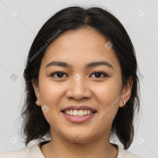 Joyful asian young-adult female with medium  brown hair and brown eyes