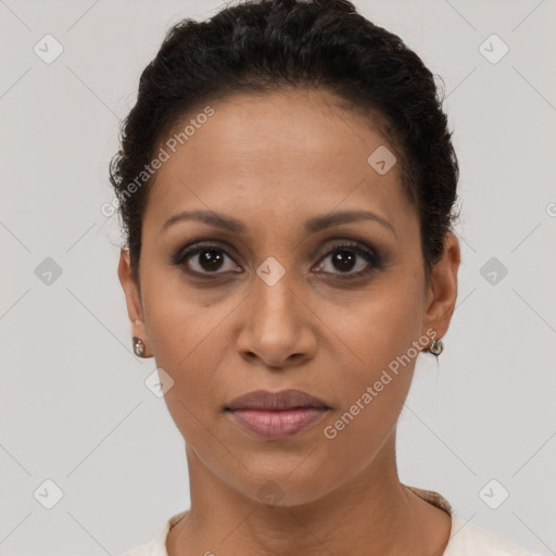 Joyful latino young-adult female with short  brown hair and brown eyes