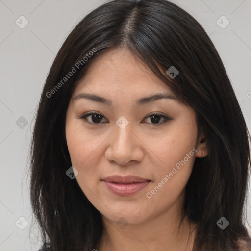 Joyful asian young-adult female with long  brown hair and brown eyes