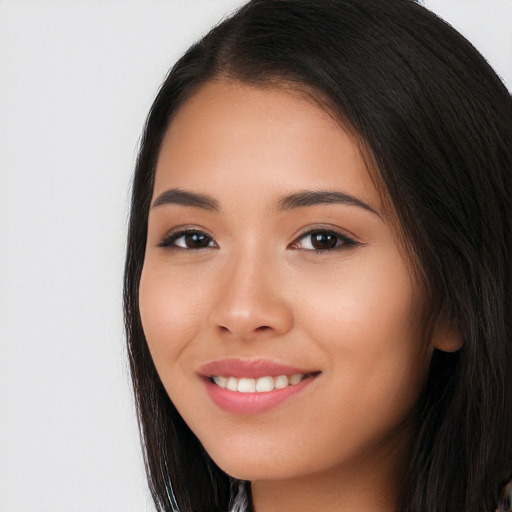 Joyful white young-adult female with long  black hair and brown eyes