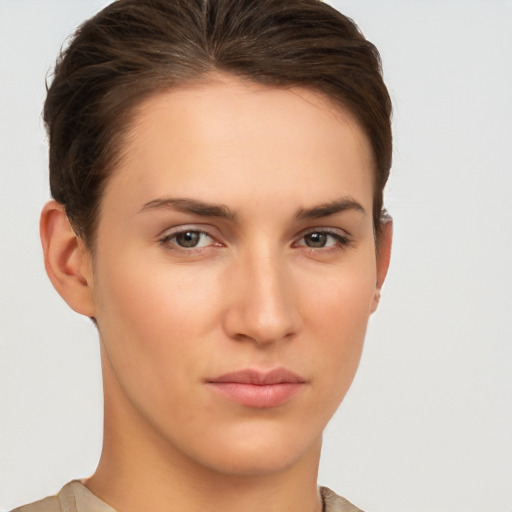 Neutral white young-adult female with short  brown hair and brown eyes