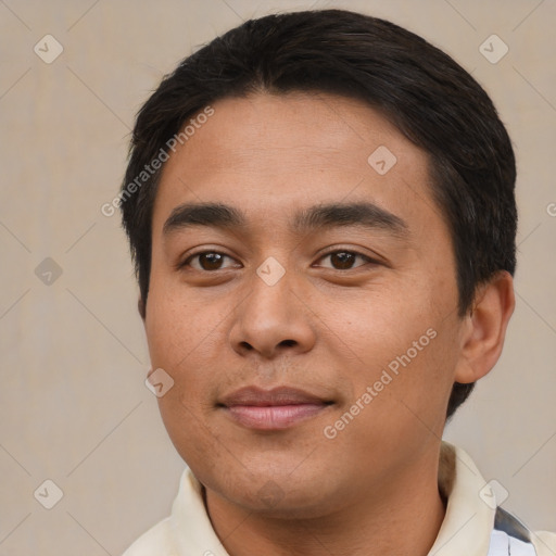 Joyful asian young-adult male with short  black hair and brown eyes