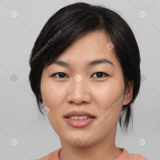 Joyful asian young-adult female with medium  black hair and brown eyes