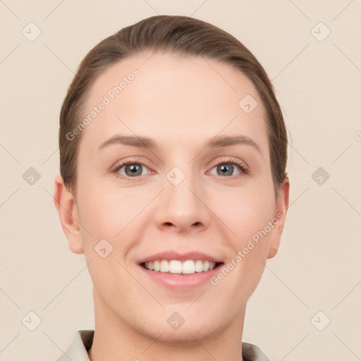 Joyful white young-adult female with short  brown hair and grey eyes